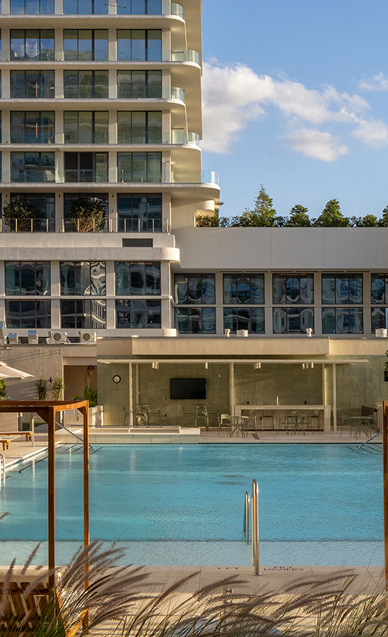 rooftop pool with umbrellas and cabanas